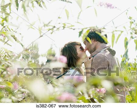 Young couple about to kiss View Large Photo Image Stock Photo - Young couple about to kiss. Fotosearch