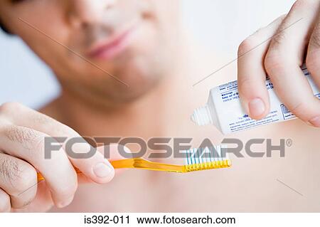 Man brushing his teeth View Large Photo Image Stock Image - Man brushing his teeth. Fotosearch