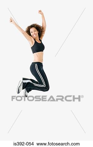 Picture - Woman jumping for joy. Fotosearch