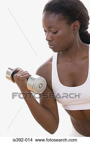 Picture - Woman weight training. Fotosearch