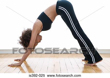 Stock Photography - Young woman doing yoga. Fotosearch