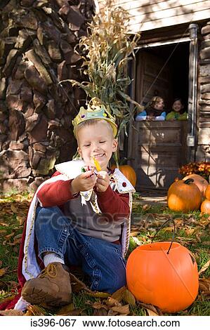Boy in costume with sweets View Large Photo Image Stock Photo - Boy in costume with sweets. Fotosearch