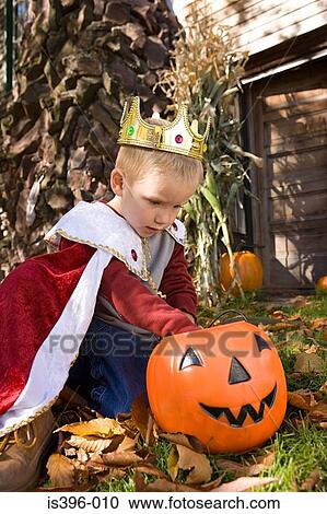 Boy looking in jack o lantern View Large Photo Image Stock Image - Boy looking in jack o lantern. Fotosearch