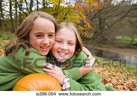 Friends hugging View Large Photo Image Picture - Friends hugging. Fotosearch