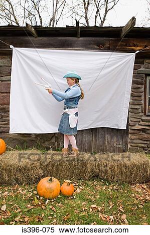 Girl pretending to be sheriff View Large Photo Image Stock Photography - Girl pretending to be sheriff. Fotosearch