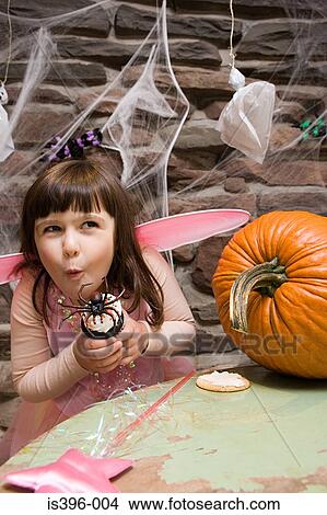 Girl with a spider cake View Large Photo Image Picture - Girl with a spider cake. Fotosearch