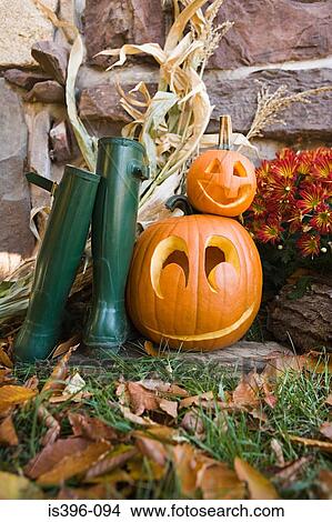 Rubber boots and pumpkins View Large Photo Image Picture - Rubber boots and pumpkins. Fotosearch