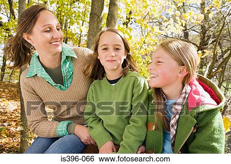 Stock Photograph - Woman and girls. Fotosearch