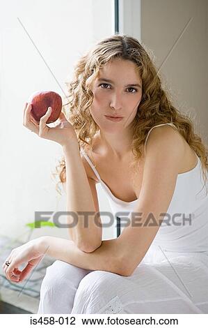 Woman holding apple View Large Photo Image Stock Image - Woman holding apple. Fotosearch