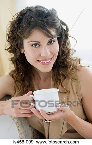 Woman holding teacup View Large Photo Image Stock Photo - Woman holding teacup. Fotosearch