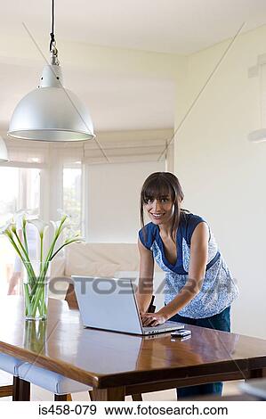 Woman using laptop View Large Photo Image Stock Photo - Woman using laptop. Fotosearch