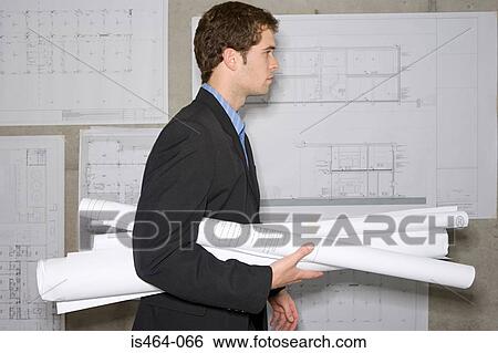 Architect with plans View Large Photo Image Stock Photograph - Architect with plans. Fotosearch