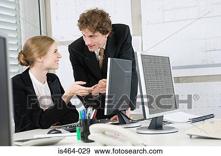 Stock Photo - Colleagues talking. Fotosearch