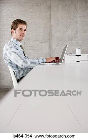 Picture - Man at his desk. Fotosearch