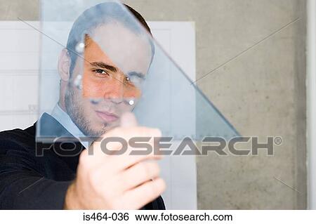 Man holding a set square View Large Photo Image Stock Photograph - Man holding a set square. Fotosearch