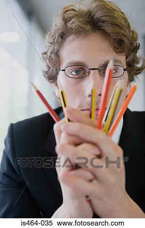 Man holding pencils View Large Photo Image Stock Photography - Man holding pencils. Fotosearch