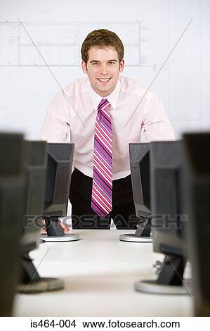 Man in an office View Large Photo Image Picture - Man in an office. Fotosearch