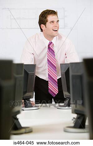 Man in an office View Large Photo Image Stock Photography - Man in an office. Fotosearch