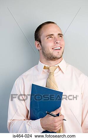 Picture - Office worker smiling. Fotosearch