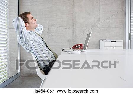 Satisfied office worker View Large Photo Image Stock Photo - Satisfied office worker. Fotosearch