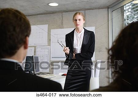Stock Photo - Woman giving a presentation. Fotosearch