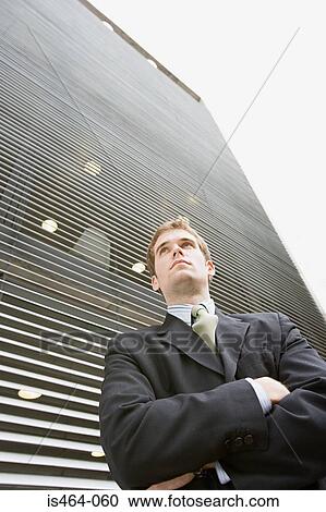Young businessman looking up View Large Photo Image Stock Image - Young businessman looking up. Fotosearch