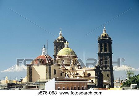 Stock Photo - Puebla cathedral and volcanoes. Fotosearch