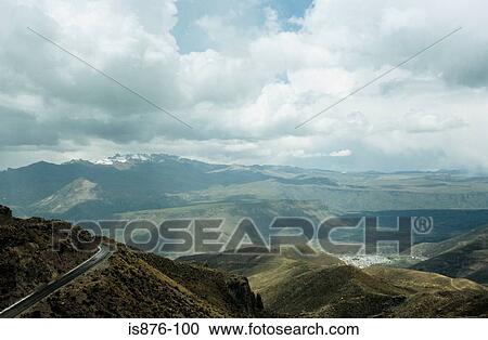 Stock Image - Road through mountains. Fotosearch