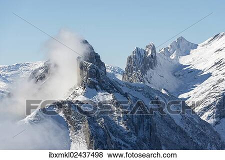 Stock Photo - "A cloud hanging next to Staubernkanzel mountain, 1860m, Kreuzberge mountains at the back, canton of Appenzell Innerrhoden, Switzerland, Europe". Fotosearch