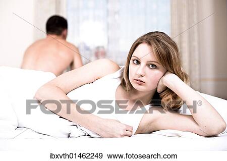 Stock Photo - A couple in bed. Fotosearch