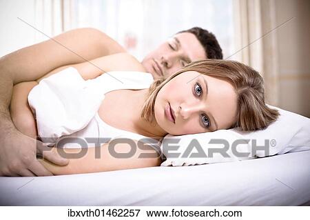 A couple in bed View Large Photo Image Stock Photo - A couple in bed. Fotosearch