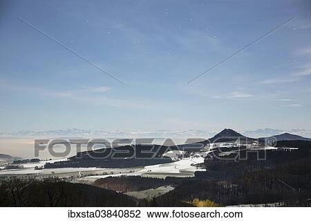 "A full moon night with stars, from Hegaublick lookout with the Hegau volcanoes Hohenhewen, Hohenstoffel, Hohentwiel, Hohenkrahen, Hegau, Baden-Wurttemberg, Germany, Europe" View Large Photo Image Stock Image - "A full moon night with stars, from Hegaublick lookout with the Hegau volcanoes Hohenhewen, Hohenstoffel, Hohentwiel, Hohenkrahen, Hegau, Baden-Wurttemberg, Germany, Europe". Fotosearch