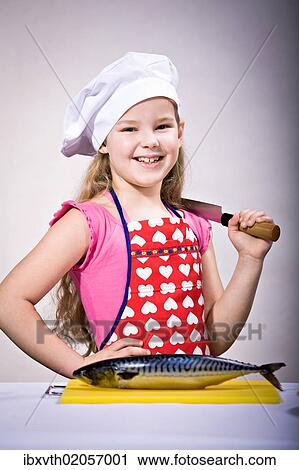 A girl preparing fish View Large Photo Image Stock Image - A girl preparing fish. Fotosearch