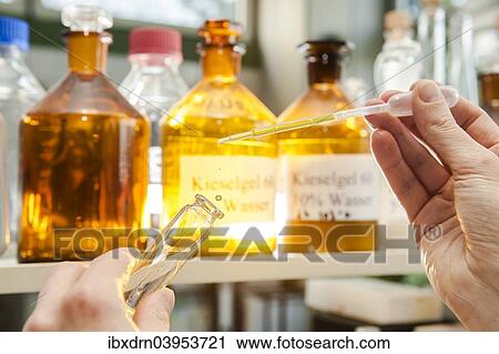 A laboratory worker using a pipette to fill a chemical liquid in a glass container View Large Photo Image Stock Image - A laboratory worker using a pipette to fill a chemical liquid in a glass container. Fotosearch