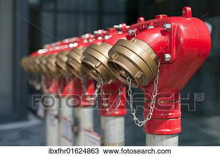 A number of fire water lines in front of a building View Large Photo Image Stock Image - A number of fire water lines in front of a building. Fotosearch