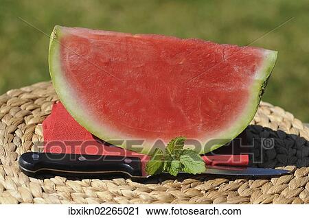 A piece of watermelon and a knife View Large Photo Image Stock Image - A piece of watermelon and a knife. Fotosearch