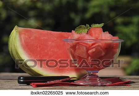 "A piece of watermelon and watermelon cubes in a glass bowl, knife" View Large Photo Image Stock Photography - "A piece of watermelon and watermelon cubes in a glass bowl, knife". Fotosearch