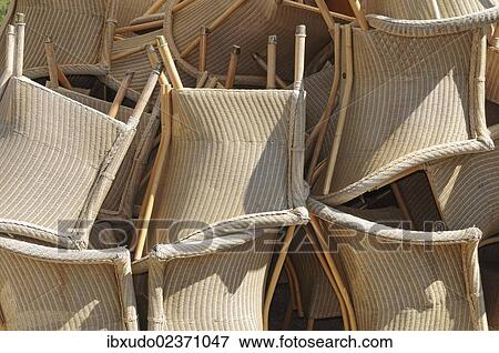 A pile of several wicker chairs View Large Photo Image Stock Photo - A pile of several wicker chairs. Fotosearch