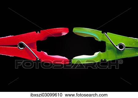 "A red clothes-peg and a green clothes-peg are attacking each other, symbolic image for political power struggles" View Large Photo Image Stock Image - "A red clothes-peg and a green clothes-peg are attacking each other, symbolic image for political power struggles". Fotosearch