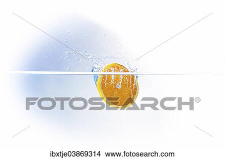 A slice of orange falling into water View Large Photo Image Picture - A slice of orange falling into water. Fotosearch