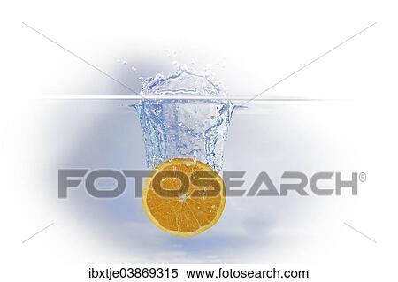 A slice of orange falling into water View Large Photo Image Stock Photography - A slice of orange falling into water. Fotosearch