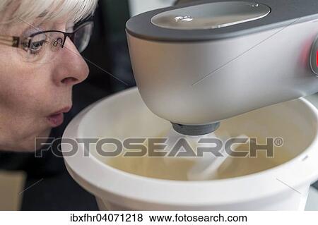 "A wide-eyed woman looking at her kitchen machine, Germany, Europe" View Large Photo Image Stock Photo - "A wide-eyed woman looking at her kitchen machine, Germany, Europe". Fotosearch