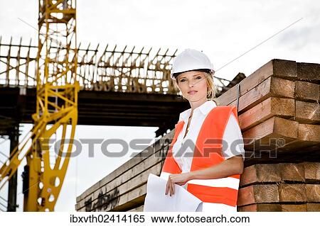 "A young female constructor at building of a new motorway, Germany, Europe" View Large Photo Image Stock Photography - "A young female constructor at building of a new motorway, Germany, Europe". Fotosearch