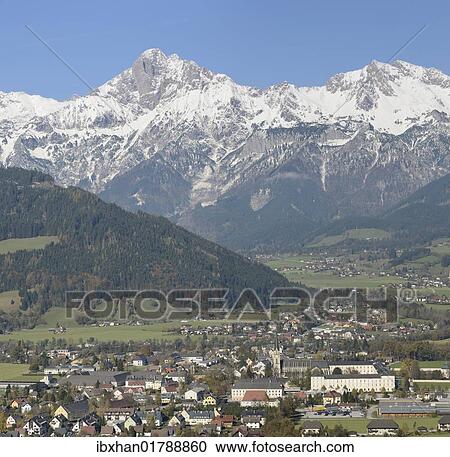 Stock Image - "Admont town centre and abbey, Haller Mauern mountain chain at the back, Admont, Gesaeuse mountain region, Styria, Austria, Europe". Fotosearch