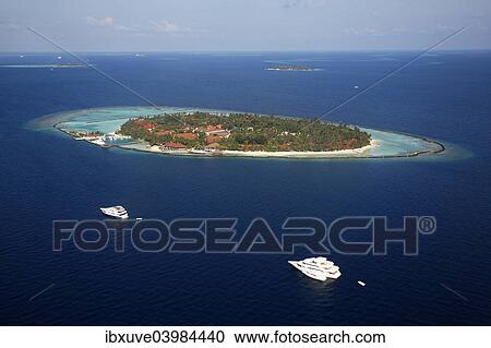 Stock Image - "Aerial view, an island of the Maldives with a coral reef, Indian Ocean, atoll, Maldives, Asia". Fotosearch