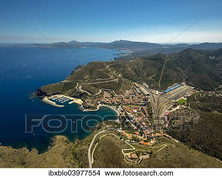 "Aerial view, border town, Mediterranean coast, bay, harbour, Portbou, Costa Brava, Catalonia, Spain, Europe" View Large Photo Image Picture - "Aerial view, border town, Mediterranean coast, bay, harbour, Portbou, Costa Brava, Catalonia, Spain, Europe". Fotosearch