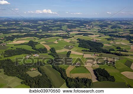 Stock Image - "Aerial view, fields and meadows, alpine upland, Taufkirchen an der Pram, Upper Austria, Austria, Europe". Fotosearch