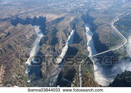 "Aerial view, gorge with the Victoria Falls Bridge over the Zambezi River, at Victoria Falls, Livingstone, Zambia, Africa" View Large Photo Image Stock Image - "Aerial view, gorge with the Victoria Falls Bridge over the Zambezi River, at Victoria Falls, Livingstone, Zambia, Africa". Fotosearch