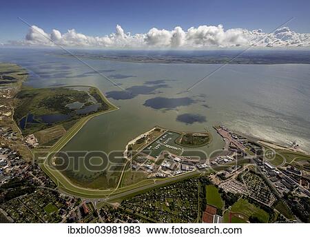 Stock Image - "Aerial view, harbour of Norderney with ferry pier, Wadden Sea, Norderney, island in the North Sea, East Frisian Islands, Lower Saxony, Germany, Europe". Fotosearch