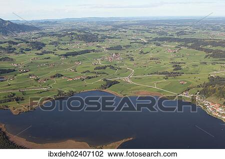 Stock Image - "Aerial view, Hopfensee lake in Ostallgaeu, Allgaeu, Bavaria, Germany, Europe". Fotosearch